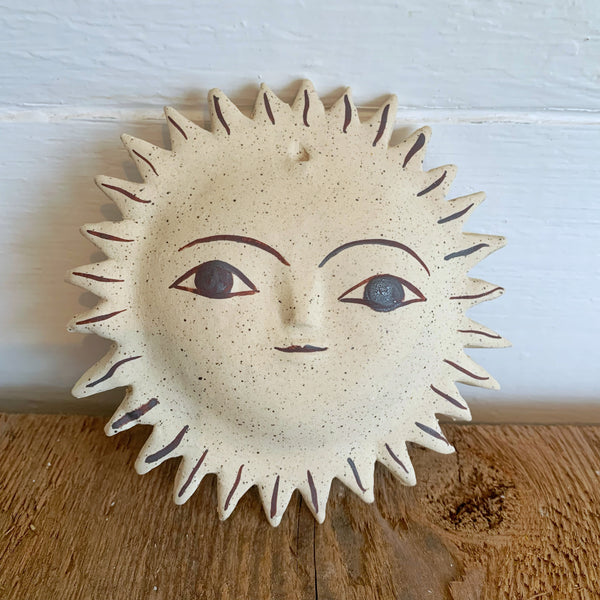 sun face with iron oxide stain