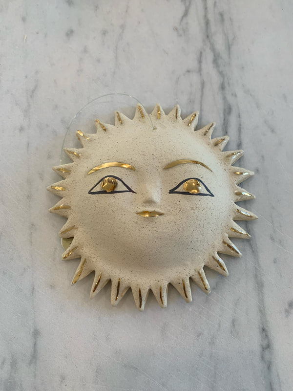 Gold sun face
