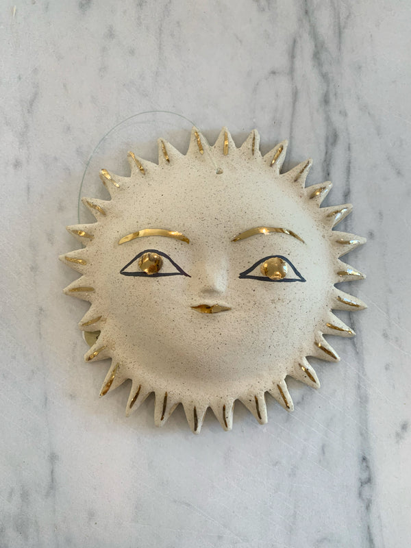 Gold sun face